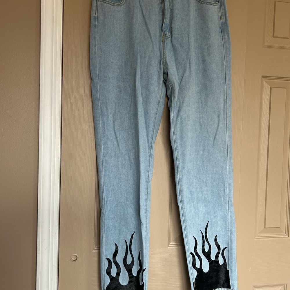 SHEIN Light Blue Jeans with Black Flame Design
